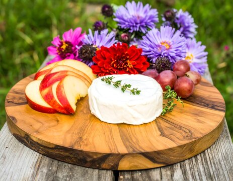 Cheese and fruit platter with flowers - Powered by Adobe