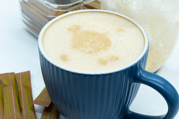 Blue ribbed mug of caffe latte