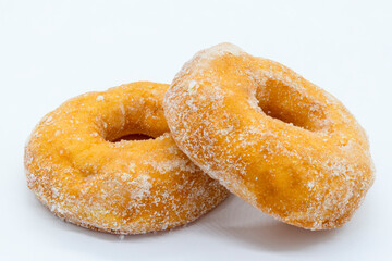 Two Crispie Doiughnuts on a white blackground