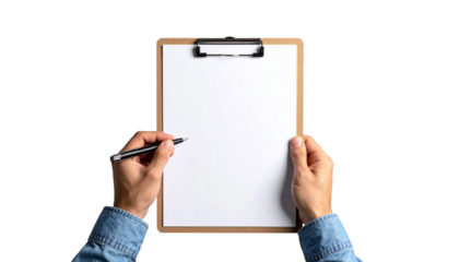 A person's hands holding a clipboard with a pen poised above a blank paper, ready to write