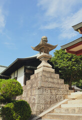 Big stone lantern at the entrance of the Japanese shrine.