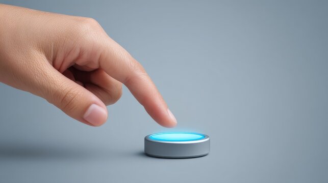 Human Hand Touching a Glowing Blue Button on a Simple Gray Background for Conceptual Themes of Interaction, Technology, Communication, and Innovation