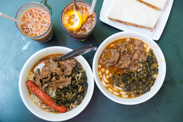 Traditional Hong Kong cafe meal with satay beef macaroni and lemon tea