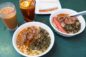 Delicious Hong Kong cafe breakfast with satay beef macaroni and iced tea