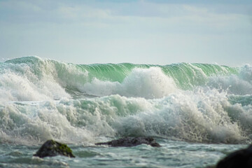 Big waves crashing on a rocky seashore