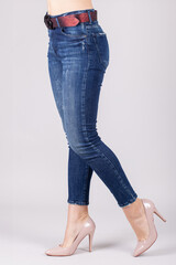 Woman Wearing Fitted Blue Denim Skinny Jeans. Casual Fashion and Apparel Concept