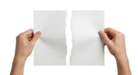Isolated sheet of paper ripped in half held in hand, conceptual of separation and conflict