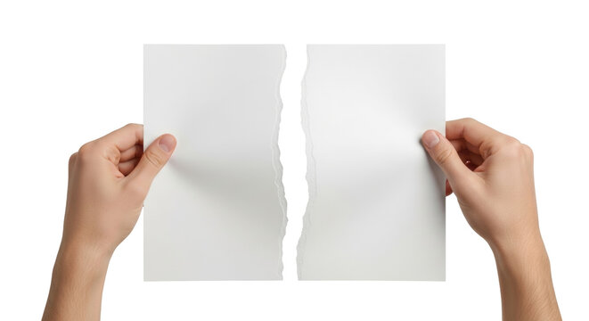 Isolated sheet of paper ripped in half held in hand, conceptual of separation and conflict