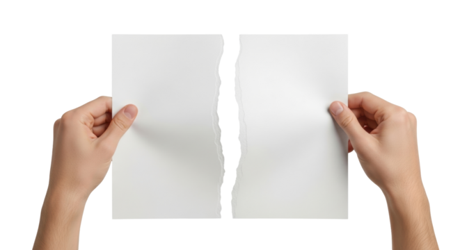 Isolated sheet of paper ripped in half held in hand, conceptual of separation and conflict