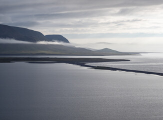 island, shore and rocks on the seashore in iceland