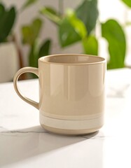 Obraz premium Creamy ceramic mug with white accent on marble surface, green foliage