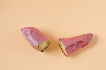 Roasted Japanese sweet potatoes on background.