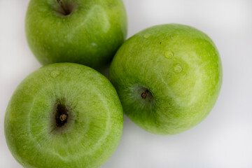 Minimal flat lay green apples on white background clean copy space eco branding template