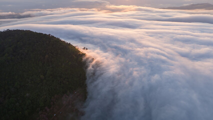 Clouds on high mountain peaks in the rainy season in the Asian rainforest.	