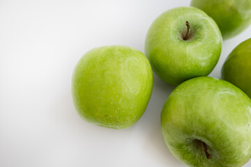 Green apples flat lay on white background with copy space eco packaging label design commercial background