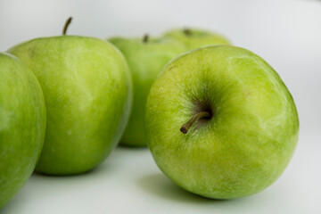 Flat Lay of Green Apples on White Background with Copy Space for Packaging and Labels