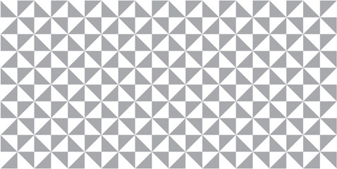 Seamless geometric triangle pattern background in gray tones, modern minimalist abstract design for wallpaper, fabric, wrapping paper, and digital backgrounds