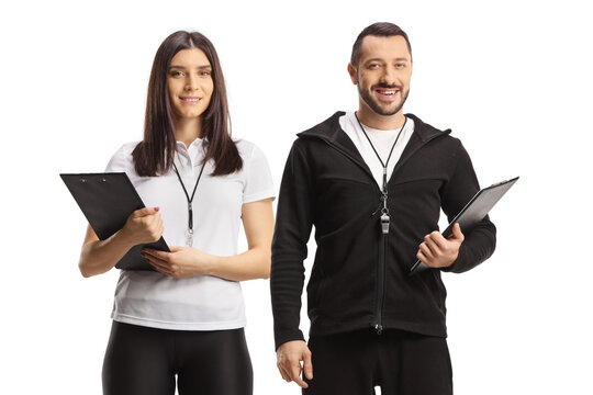 Female and male sports coaches with clipboards - Powered by Adobe
