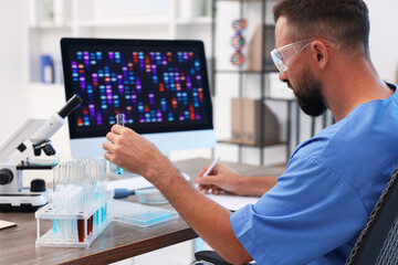 Research in genetics. Scientist working with sample at table in laboratory