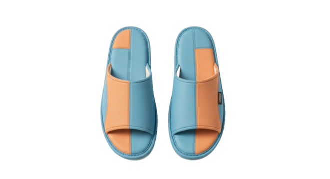 Isolated pair of indoor open toe slippers in light blue and orange color scheme casual footwear