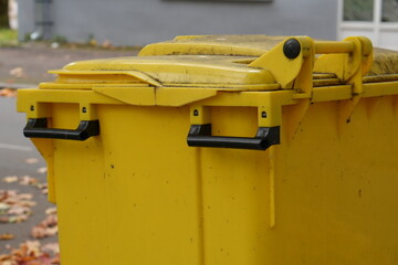 Bright Yellow Industrial Waste Container: Garbage Bin Close-up
