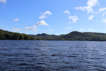 A panoramic view of a lake nestled in the Adirondacks.