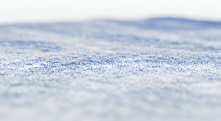 Obraz premium Delicate patterns and textures of fresh snowfall on a gently undulating surface