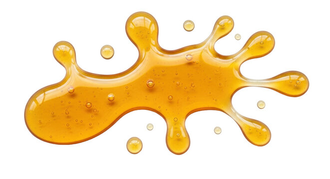 Isolated splash of golden viscous honey or nectar, transparent and glistening blobs