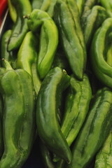 Close-up of fresh green peppers with natural texture. Organic vegetables rich in vitamins and antioxidants, perfect for vegan, Mediterranean, and healthy diet concepts.
