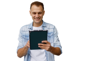 Smiling man holding digital tablet, interacting with device, enjoying technology, transparent background