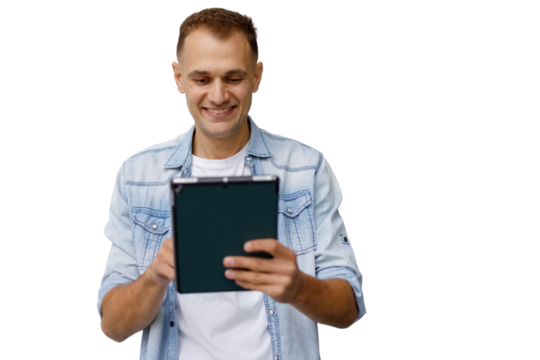 Smiling man holding digital tablet, interacting with device, enjoying technology, transparent background