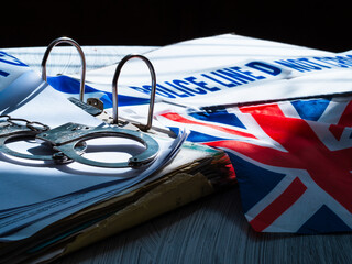 Police files with handcuffs in British police station