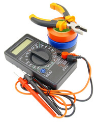 Digital multimeter, pliers and multicolored electrical tap
