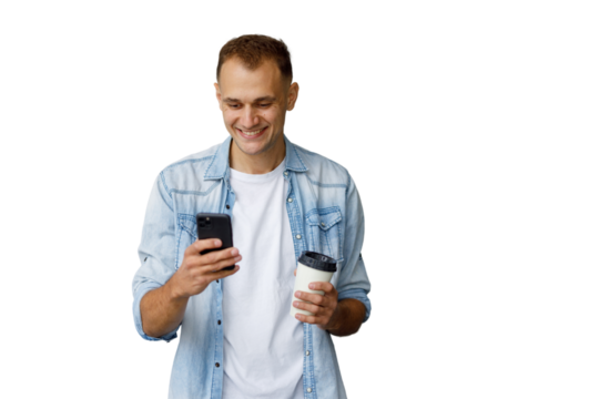 Smiling man using smartphone and holding coffee cup, communicating online, transparent background