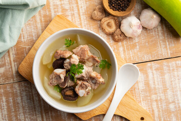 Winter Melon Soup With Pork Bone ribs in white bowl.Top view.