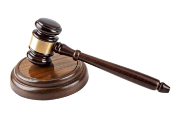 Wooden gavel and sounding block on white surface