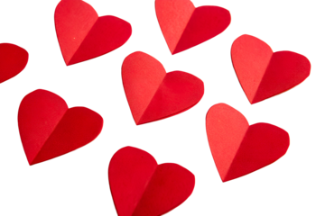 Scattered Red Paper Hearts on White Surface