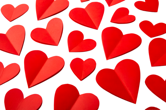 Numerous Red Paper Hearts Scattered on White Background