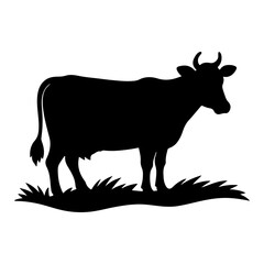 Black silhouette of a cow standing on grass