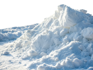 Pile of white snow illuminated by sunlight