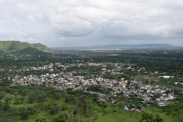 panoramic view of daulatabad city surrounded by green hills, seen from the historic daulatabad fort top