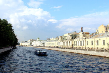 Naklejka premium A boat sails between the islands in St. Petersburg in the summer.