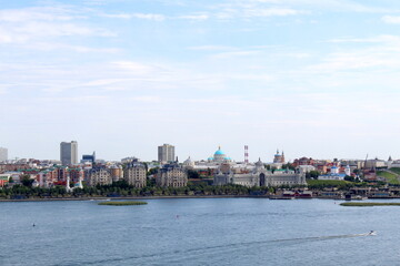 Fototapeta premium The city is visible from afar on the river bank.