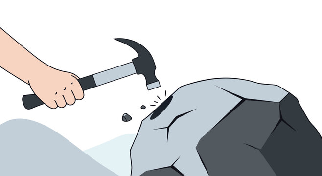 Hammer hitting a large rock to break it apart.

