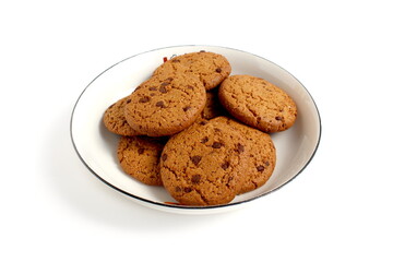 There are a lot of oatmeal cookies on the plate.