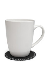 White cup with black leather coaster