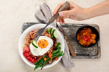 ndonesian nasi goreng (fried rice) served on a plate.