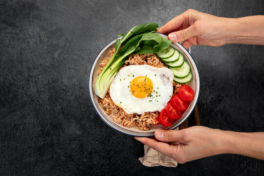 ndonesian nasi goreng (fried rice) served on a plate.