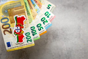 Portugal money and national emblem, Gray background, copy space, flat lay, Financial background, Euro banknotes