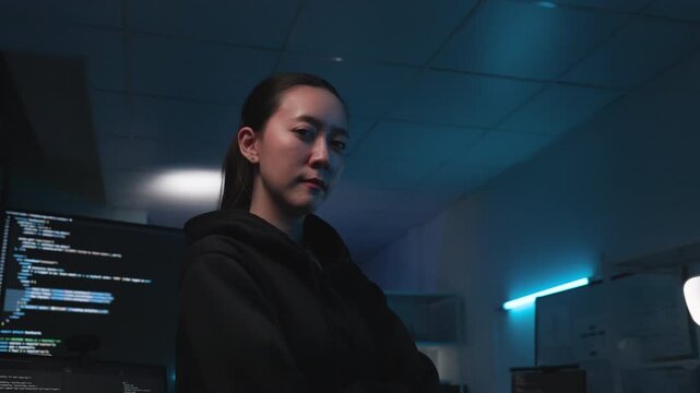 Confident Young Female Programmer at Hackathon in Dark Office